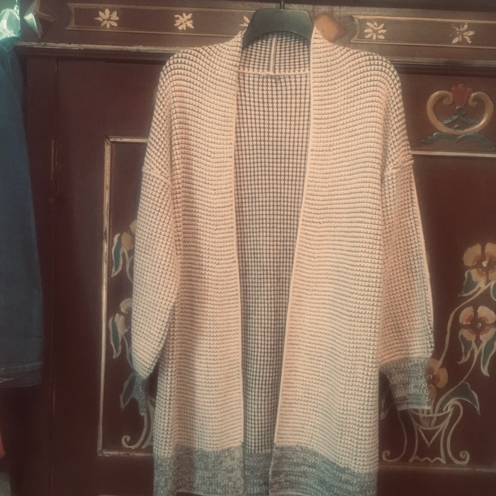 Light pink and black open sweater